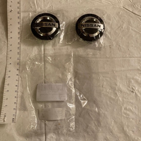 Two Replacement Nissan Hubcap Logo Inserts - Picture 1 of 3